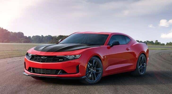 A red 2020 Chevy Camaro SS is shown from the front at an angle after leaving a used Chevy dealer near Arcadia.