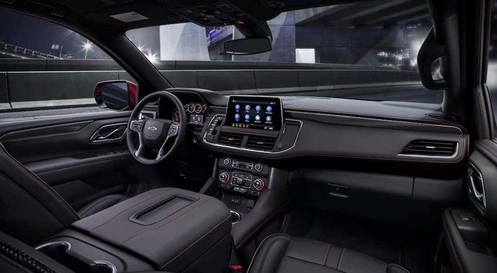 The front seats and dashboard in a 2021 Chevy Tahoe.