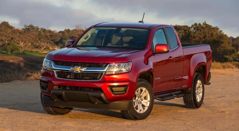 A red 2017 Chevy Colorado is shown parked off-road.