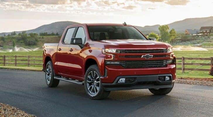A red 2021 Chevy Silverado 1500 is shown parked after viewing used trucks for sale.