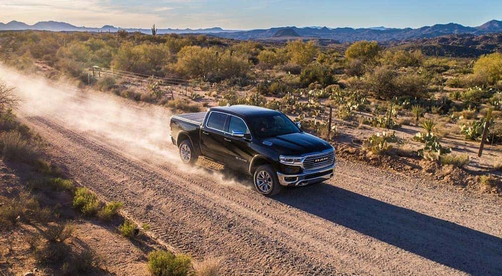 A black 2019 Ram 1500 is shown from the front at an angle.