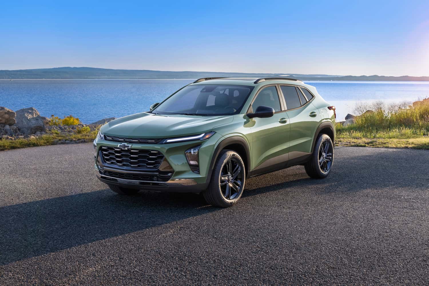 Green Chevy SUV Parked by Lake