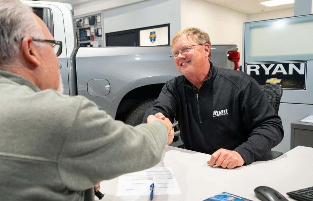 Employee and Customer Shaking Hands