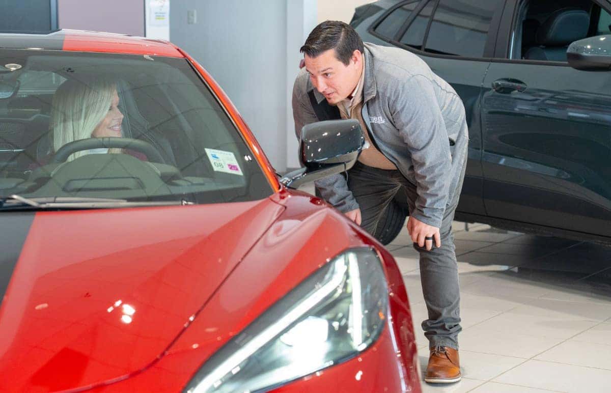 Employee Showing Customer Vehicle