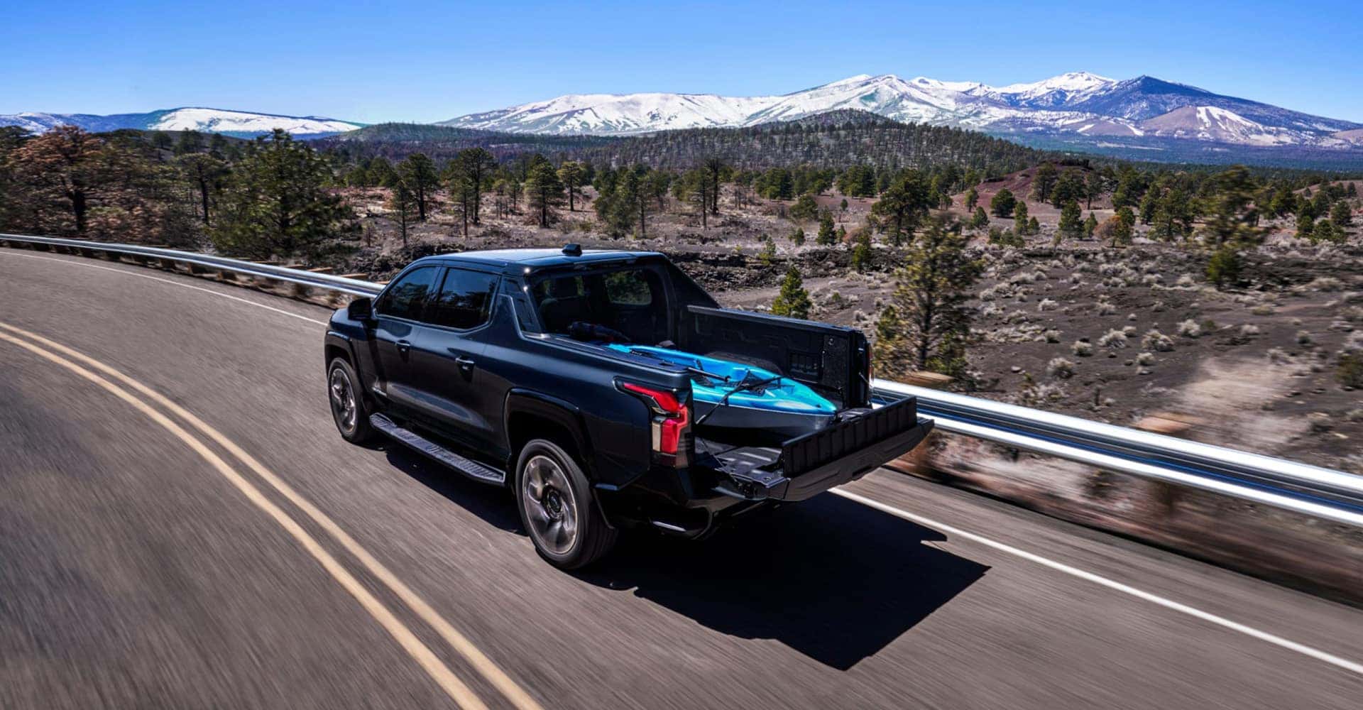 2025 Chevrolet Silverado EV driving with cargo