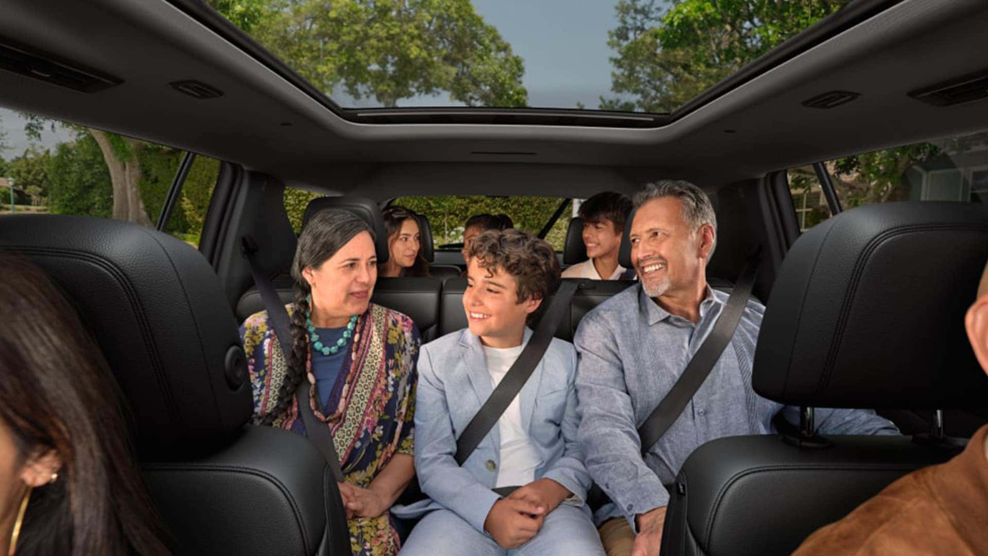 Smiling Large Family in Car