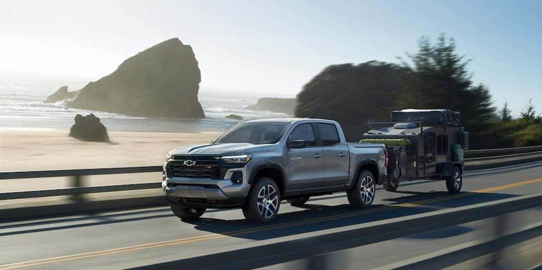 2025 Chevy Colorado Pulling a trailer on a coastal highway