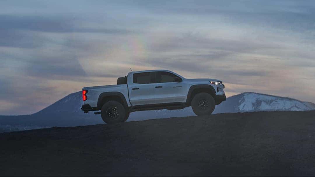 2025 Chevy Colorado scaling a hill in the high desert