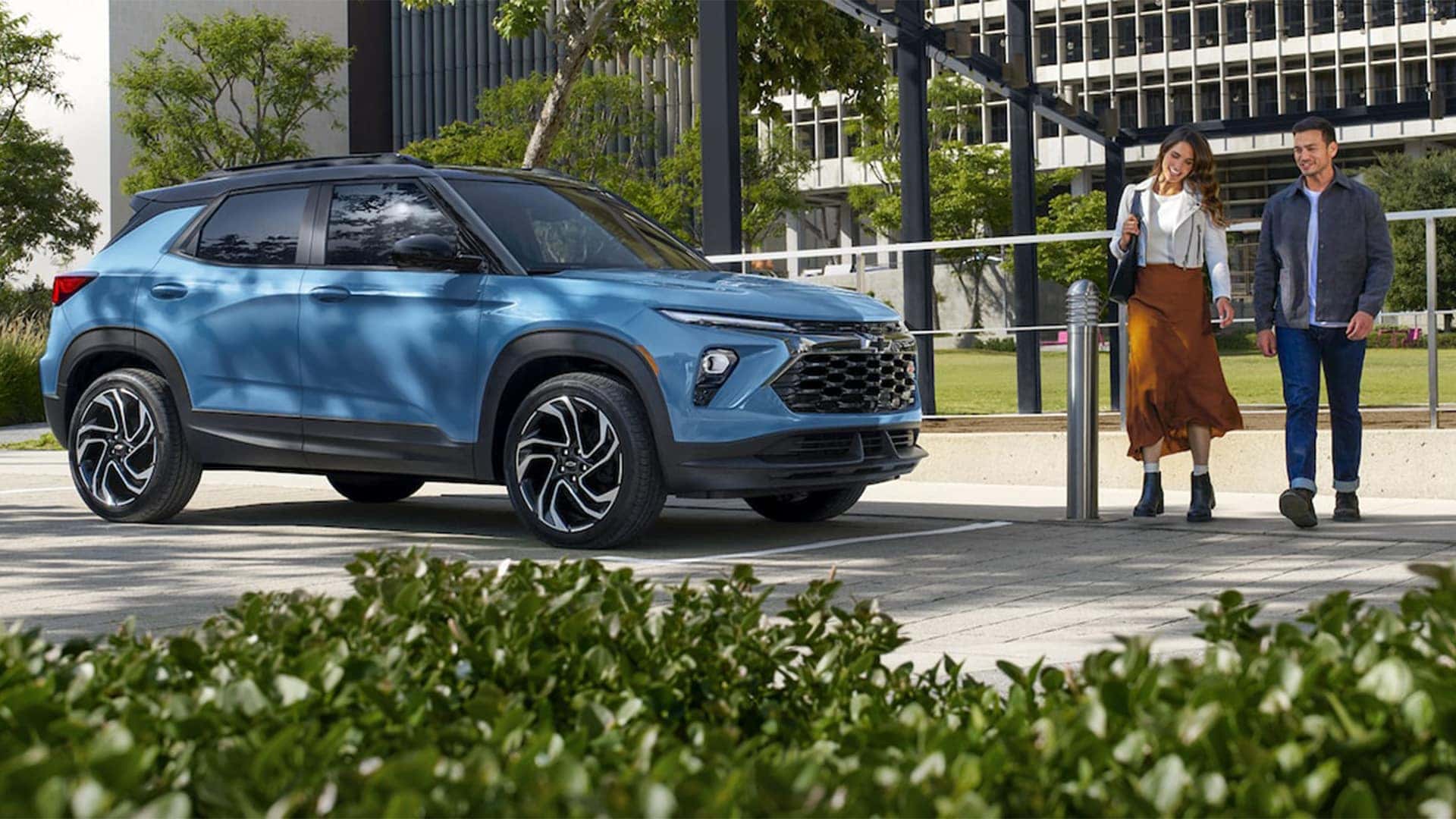 Couple Walking Next to 2026 Chevrolet Trailblazer