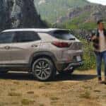 Two people hiking next to 2026 Trailblazer