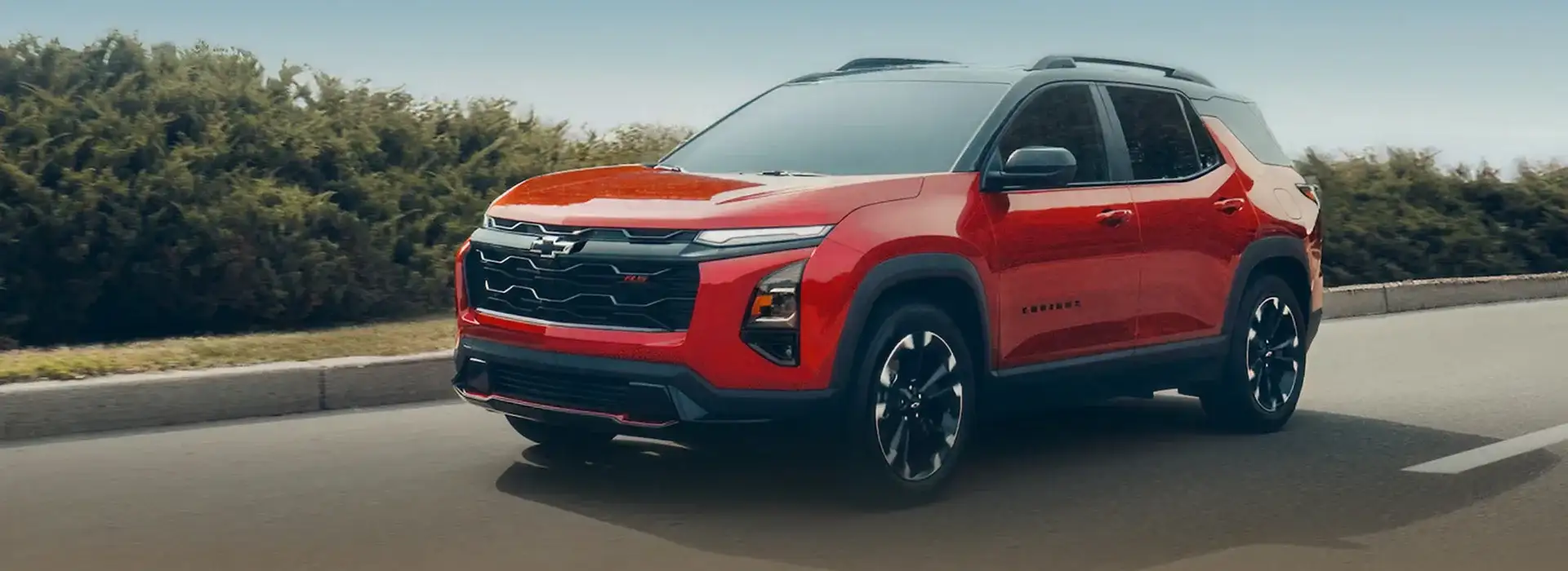 2027 Chevrolet Equinox parked in front of a building
