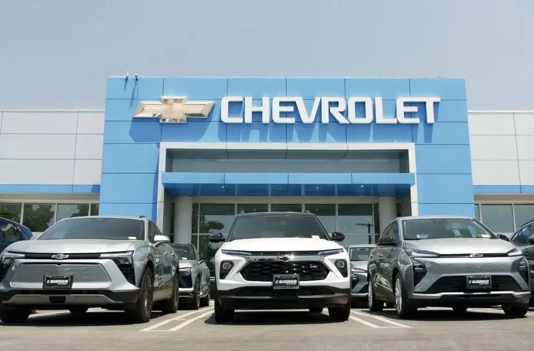 New Chevrolet SUVs and EVs lined up outside the Sierra Chevrolet dealership showroom in Monrovia, CA