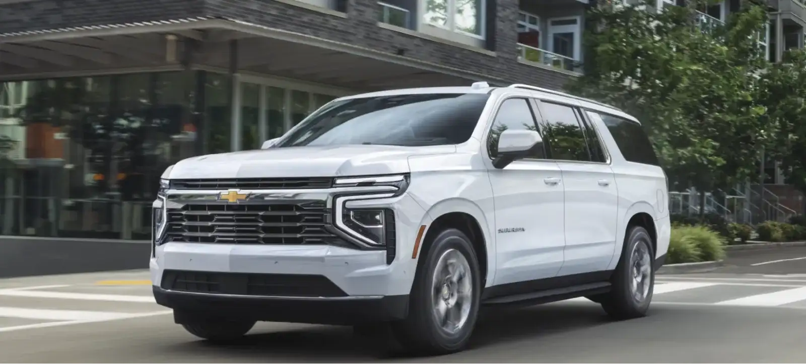 The 2027 Chevrolet Suburban LS shown in Summit White