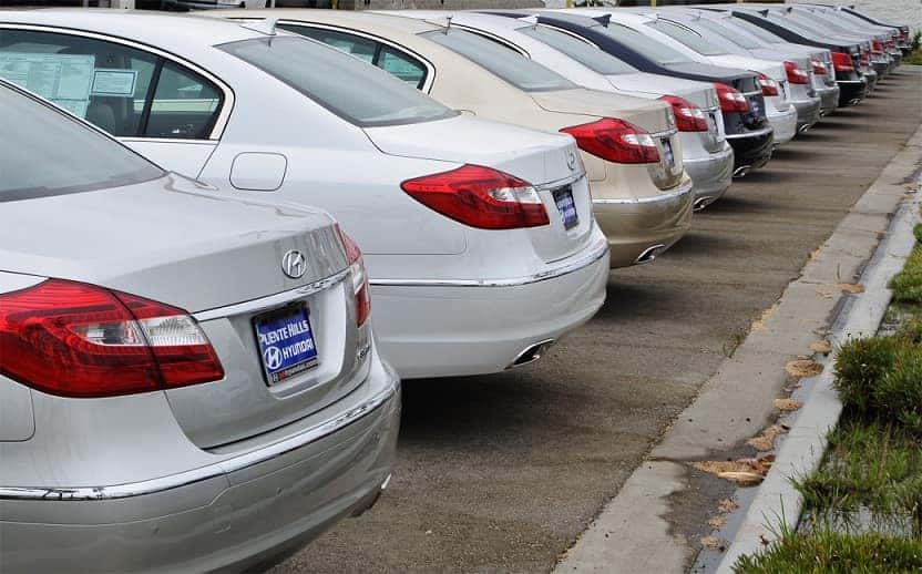 hyundai genesis cars parked in a parking lot