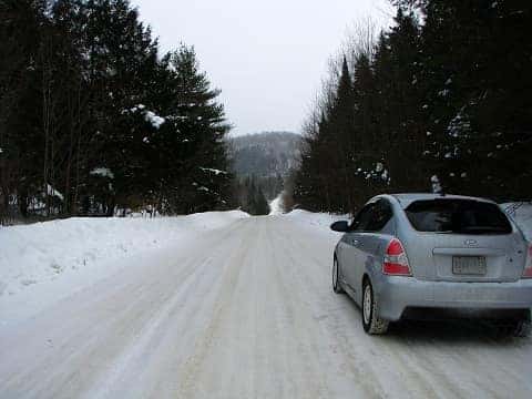 Car driving on a snowy road in spokane wa