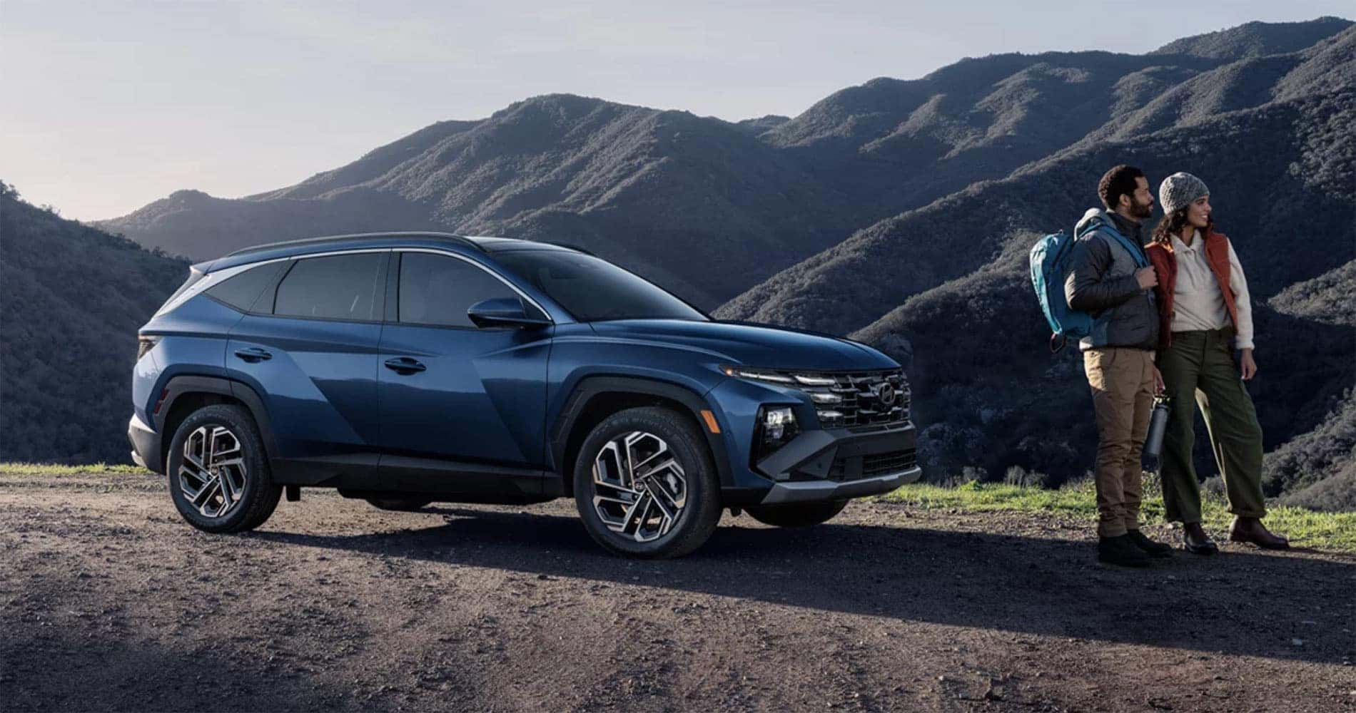 Hikers standing near a 2025 Hyundai Tucson