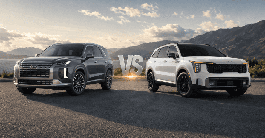 Hyundai Palisade vs Kia Sorento parked side by side on a scenic mountain road