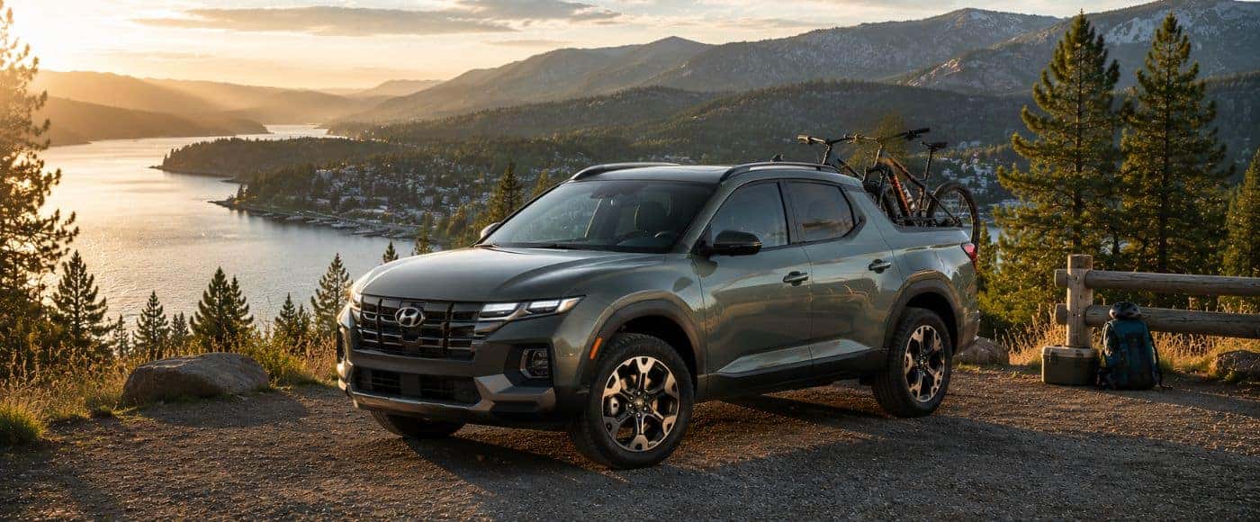 2026 Hyundai Santa Cruz overlooking a mountain lake in the Inland Northwest with bikes loaded for adventure
