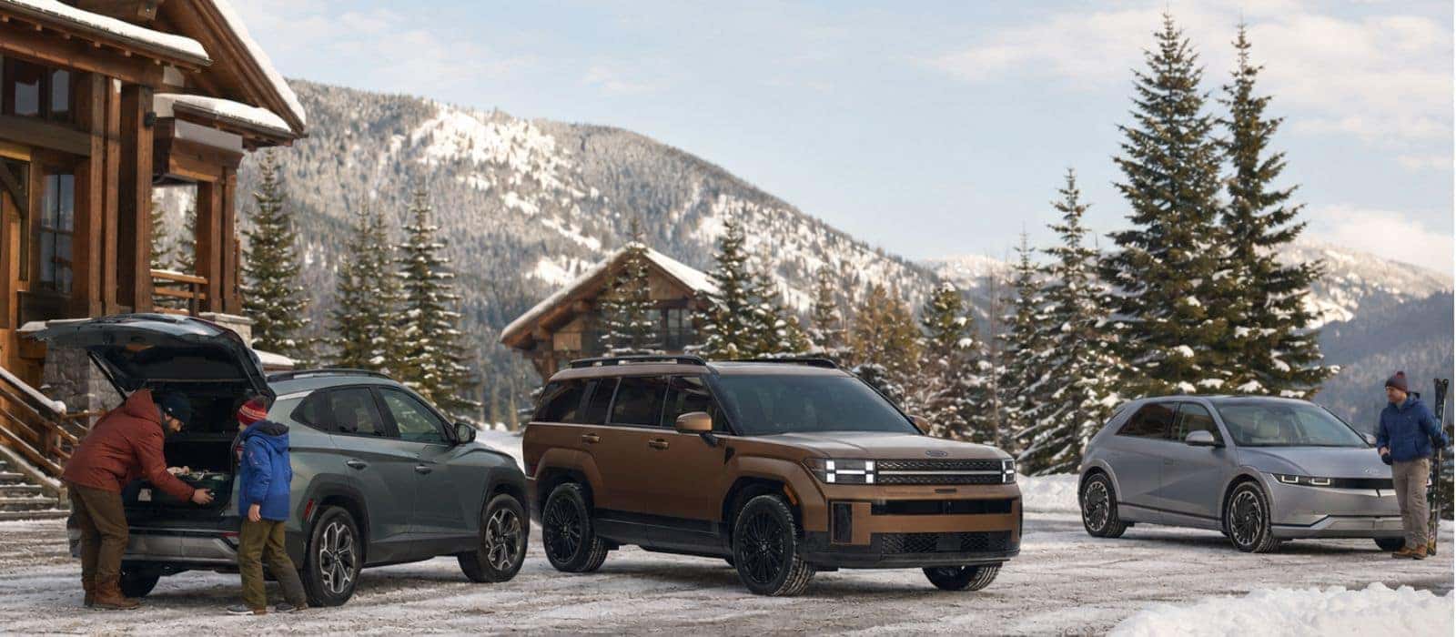 Hyundai SUVs in a mountain setting representing available HTRAC all-wheel drive capability