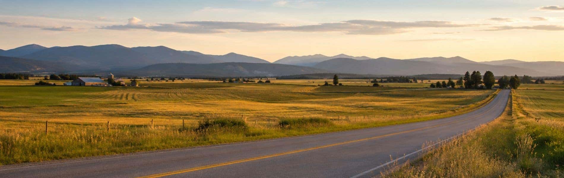 Open North Idaho landscape beneath a wide Sandpoint sky