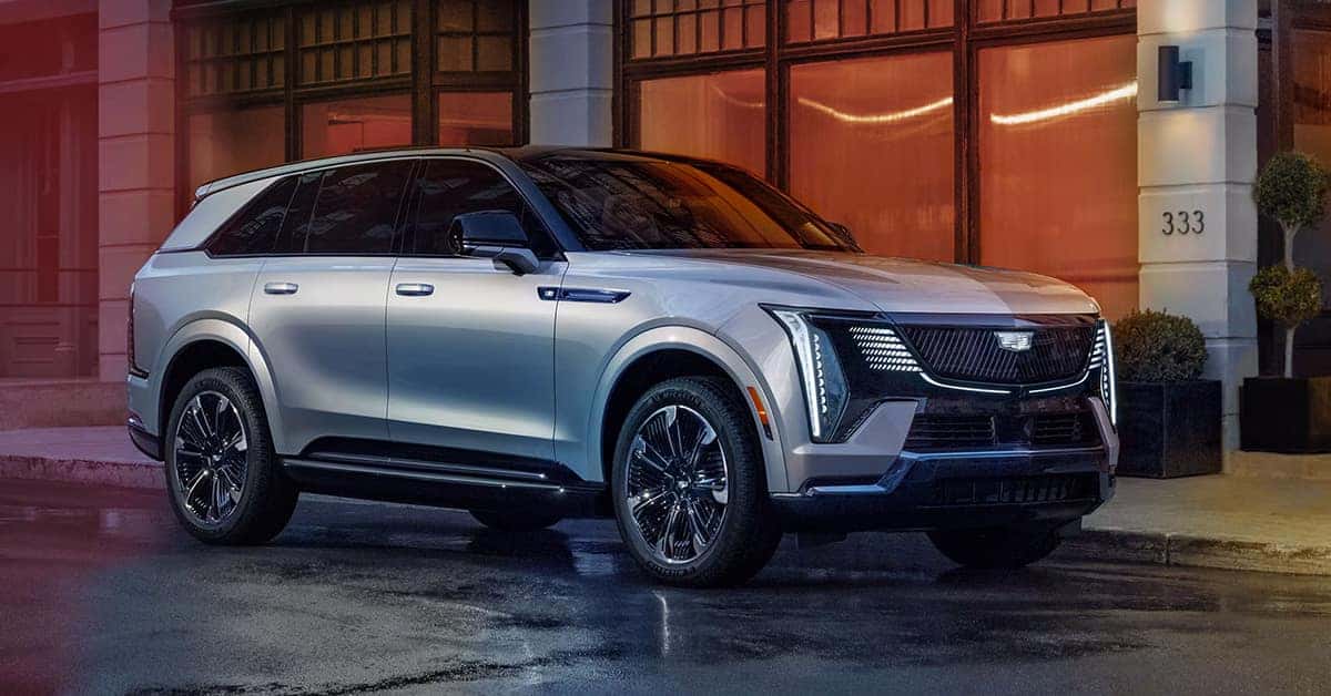 2025 Cadillac Escalade IQ parked in front of a building