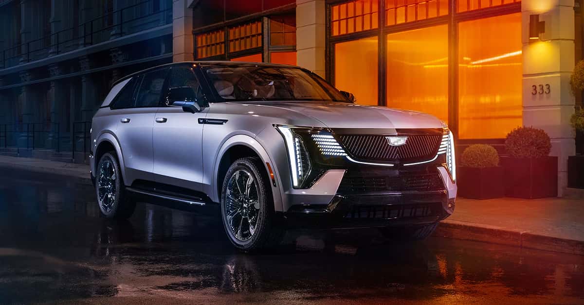 2025 Cadillac Escalade IQ parked in front of a building