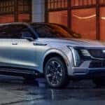 2025 Cadillac Escalade IQ driving on wet road