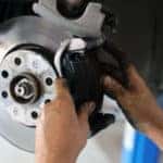 Technician working on brakes