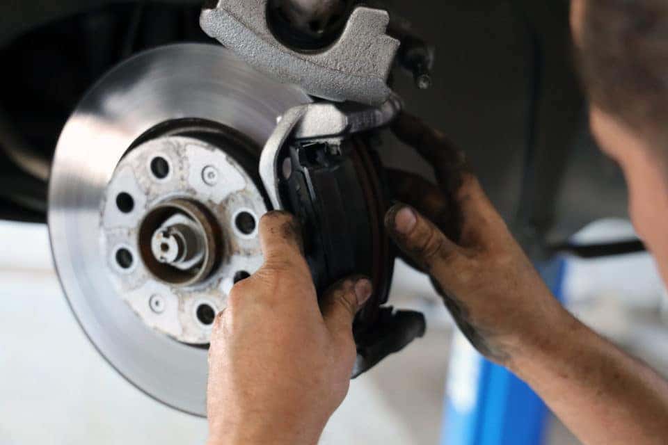 Technician working on brakes