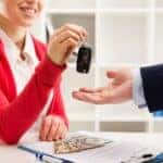 A person receiving their keys after signing a Chevrolet lease